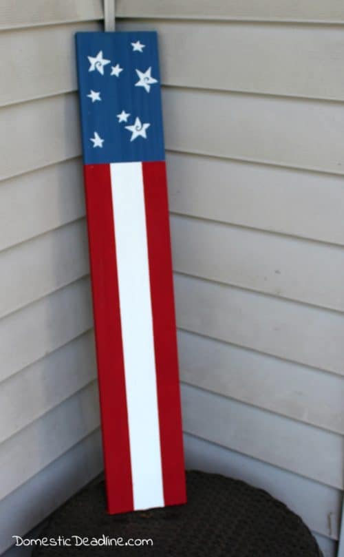 Leftover fence boards and chalk paint, turn into a simple outdoor wooden flag, perfect for Memorial Day, Flag Day, Independence Day or even all summer. http://domesticdeadline.com