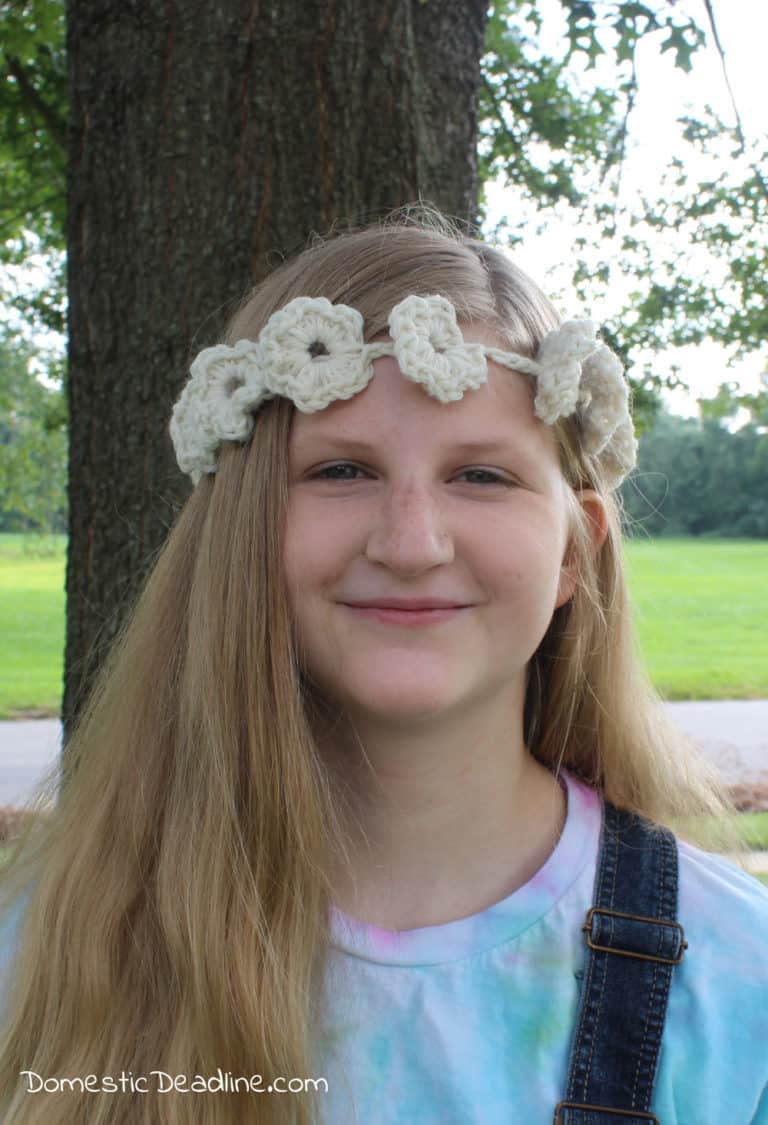 Inspired by the wedding from the movie musical Mamma Mia, this simple crocheted flower headband works up quick. Free pattern and movie challenge blog-hop www.domesticdeadline.com