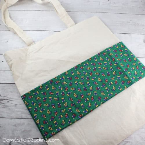 Use leftover fabric and freebie tote bags to make custom reusable gift bags to gift wrap your holiday gifts this Christmas season. Plus more upcycled projects www.domesticdeadline.com