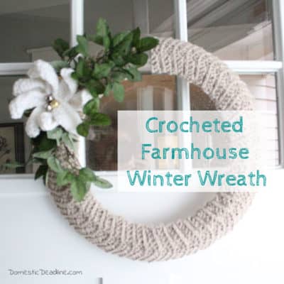 Crochet a chevron winter wreath with farmhouse style. Not just a Christmas wreath but one to survive the whole winter season. Plus dozens more wreath ideas! #12DaysofChristmas2018 www.domesticdeadline.com
