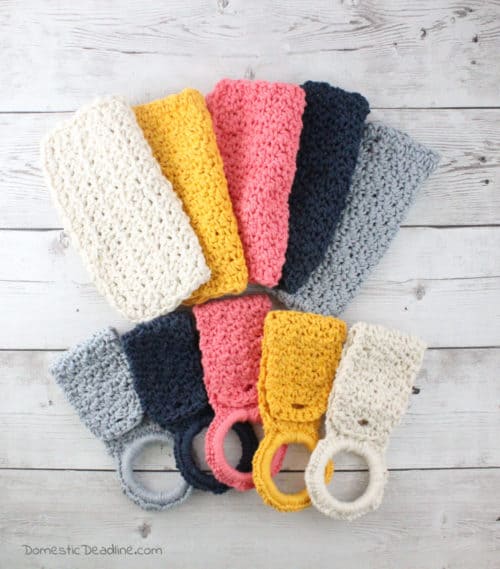 Learn how to make a quick crochet farmhouse dish towel holder using the seed stitch. Some yarn, a button, and a shower curtain ring are all you need #farmhouse #crochet www.domesticdeadline.com