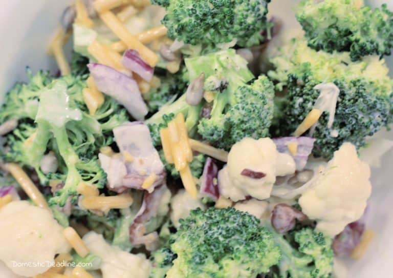 Discover a great make-ahead recipe for potlucks with a twist on traditional broccoli salad. Adding cauliflower and Cabot cheese. Keto options domesticdeadline.com