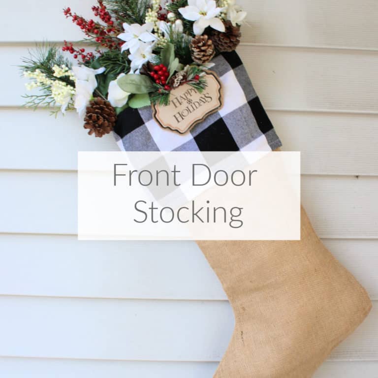 Learn how to make this easy front door stocking wreath to celebrate Christmas. Fun farmhouse style but easy to make in any Christmas style. DomesticDeadline.com