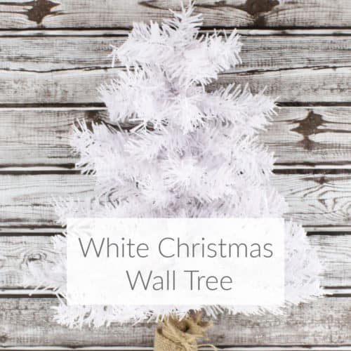 Learn how to make a rustic white Christmas wall tree with dollar store materials. Great for any winter decor, especially for a small space! DomesticDeadline.com