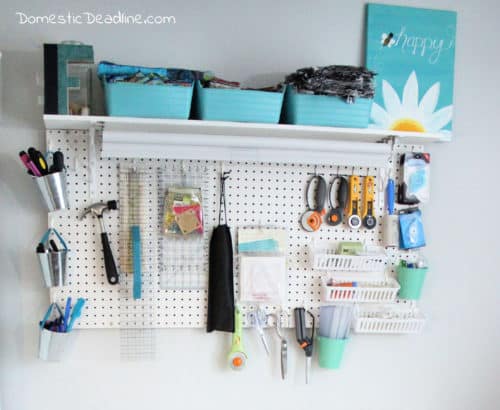 Learn how a pegboard can organize craft supplies making them easily accessible and clearing up horizontal space using vertical space. DomesticDeadline.com