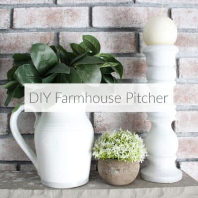 Learn how a few coats of paint can easily transform an old dated ceramic pitcher into a classic farmhouse pitcher full of greenery for mantel decor. DomesticDeadline.com