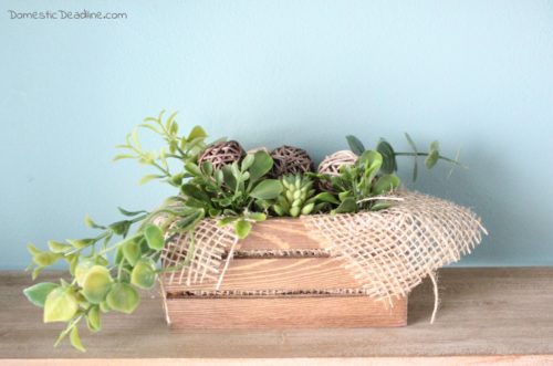 Find this easy DIY rustic greenery arrangement using craft supplies on hand or easily obtained from the dollar store. Plus more stash-busting projects. DomesticDeadline.com