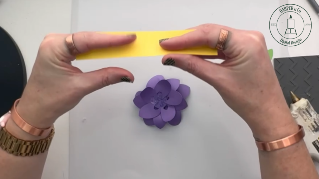 Rolling and shaping the paper center for a layered 3D paper flower
